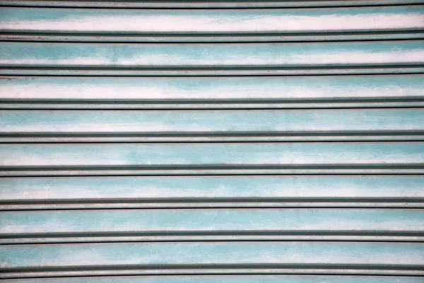 Detailní záběr na pozadí starých modrých kovových dveří. Kovový backg — Stock fotografie