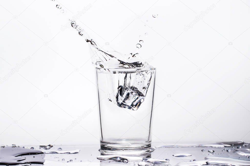 Water splashes in glass, isolated on a white background