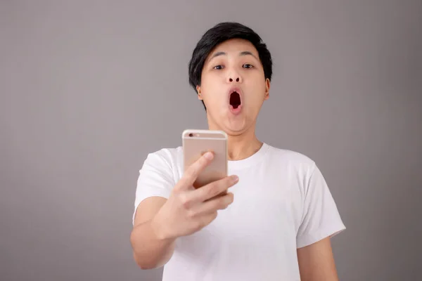 Portrait of an Asian person whose face was shocked by something — Stock Photo, Image