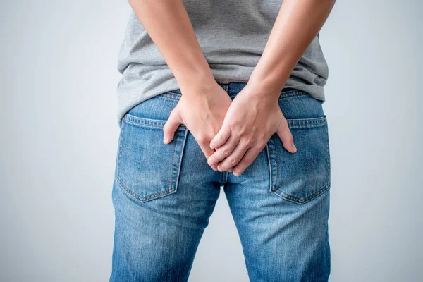 Young Man Used His Two Hands Hold His Buttocks Because — Stock Photo, Image