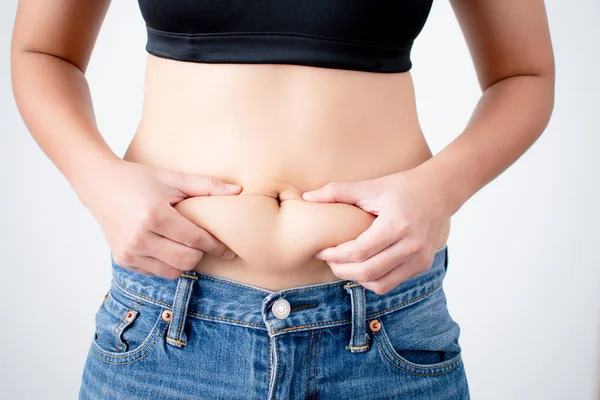 Woman Holding Excess Fat Her Belly White Background — Stock Photo, Image
