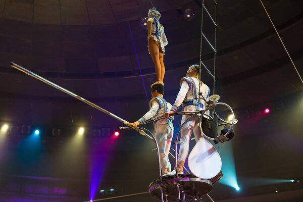 performance of aerialists in the circus arena.