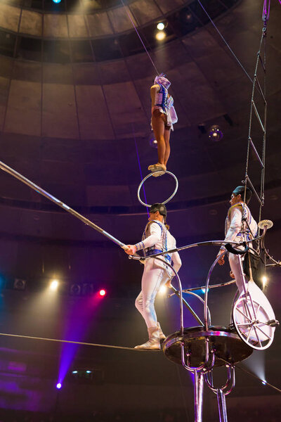 performance of aerialists in the circus arena.