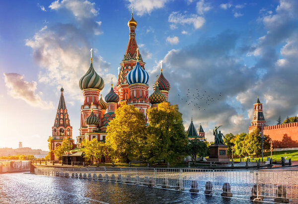 St. Basil's Cathedral on Red Square in Moscow in the light of the morning autumn sun and clouds in the blue sky