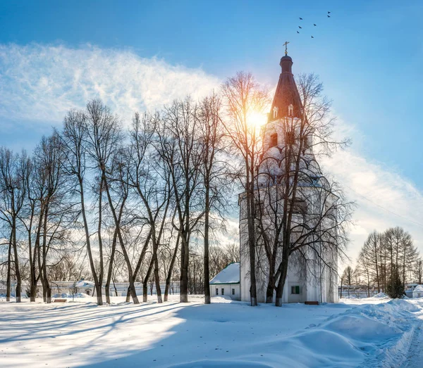 Crucifix church-bell tower and trees — Stock Photo, Image
