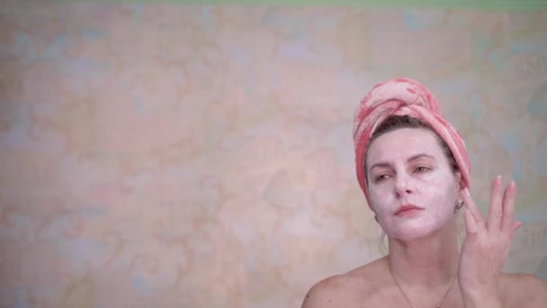 Woman Towel Her Head Applied Cosmetic Mask Rejuvenation She Looks — Stock Video