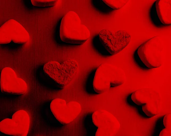 volumetric distribution hearts evenly lit by bright red lamp, valentines day concept
