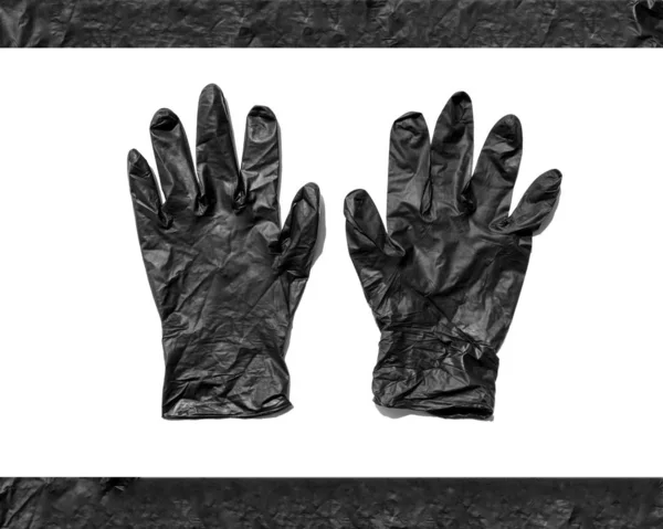 Gants froissés en caoutchouc noir isolés sur fond blanc. Nouveaux gants jetables en caoutchouc. Sujet protecteur — Photo