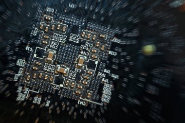Close up of a printed black computer circuit board with radial blur and darkening the edges effect clipart