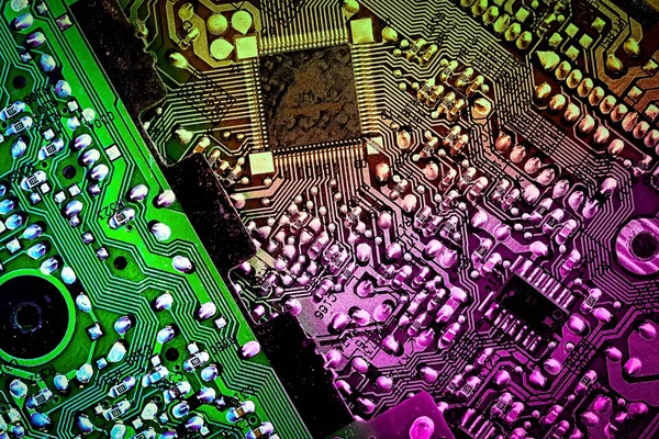 Abstract technology background computer motherboard, toned in violet yellow green colors — Stock Photo, Image