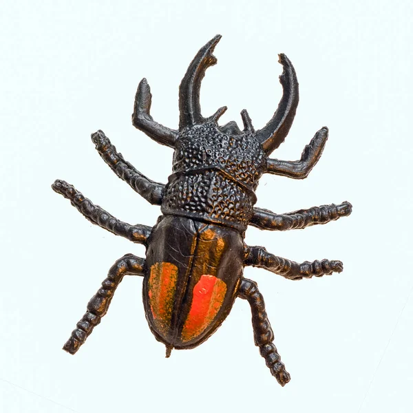 Játék replika orrszarvú bogarat, felülnézet, elszigetelt fehér background — Stock Fotó