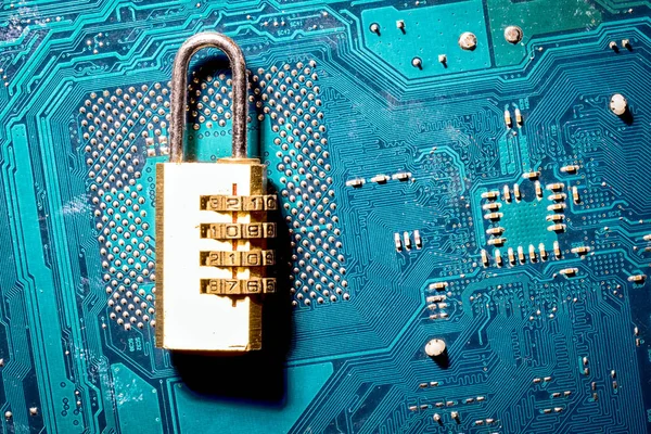 padlock on a computer circuit board, concept of information security