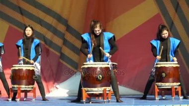 Moscow, Russia - May 14, 2017: Group of taiko drummer girls Taiko inspiration performs on the festival of martial arts `One in the field warrior`.