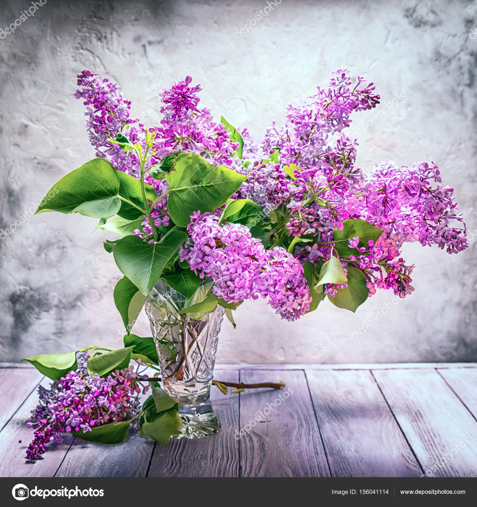 Still Life Bouquet Of Lilac In A Crystal Vase On The Background Of