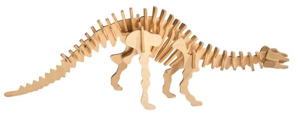 Zabawka z drewna szkielet dinozaura na białym tle — Zdjęcie stockowe