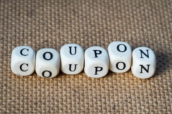 Coupon word made from toy cubes with letters — Stock Photo, Image