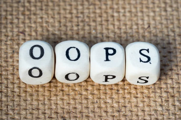 Oops word made from toy cubes with letters — Stock Photo, Image