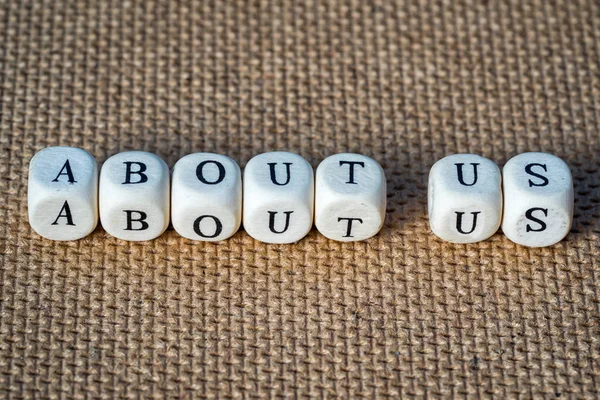 Sobre nós palavras feitas de cubos de brinquedo com letras — Fotografia de Stock