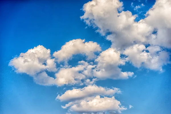 White clouds in a blue sky in a daytime — Stock Photo, Image