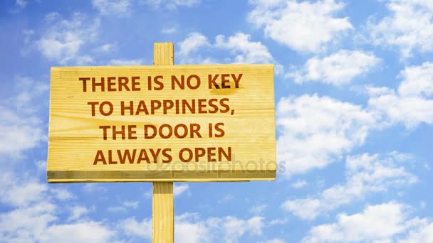 There is no key to happiness the door is always open. Words on a wooden sign against time lapse clouds in the blue sky. — Stock Video