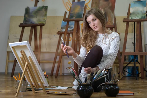 Woman Artist Sits Floor Art Studio Paints Oil Painting — 스톡 사진