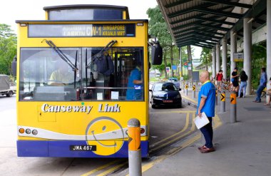 Singapore-24 DEC 2017:the bus which between Singapore and Malaysia reach station