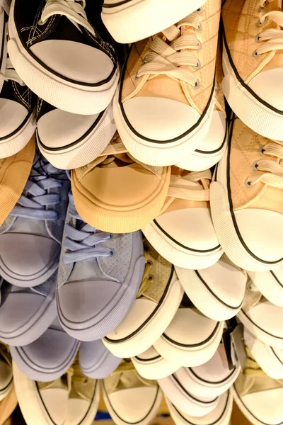 Lots of colorful canvas shoes display background view — 스톡 사진