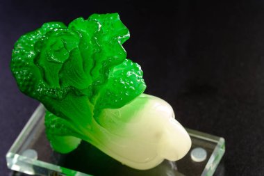 Chinese cabbage jade carving, isolated on black background clipart