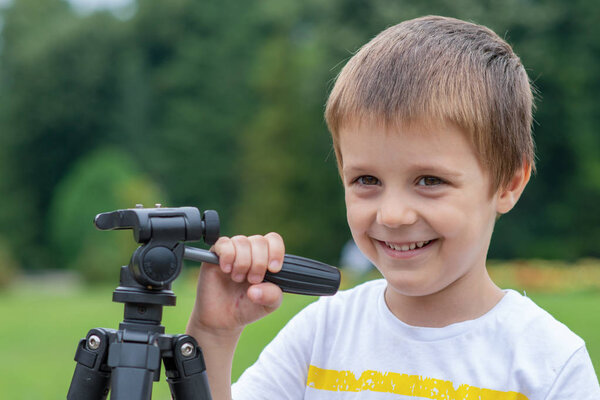 Boy singing into a fake microphone