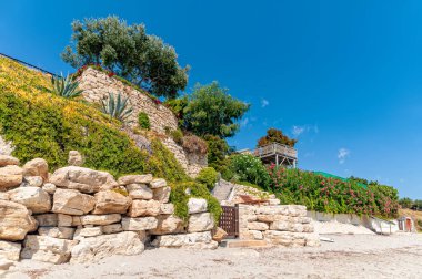 Halkidiki, Greece - September 03,2019: A beautiful Greek beach on the Aegean Sea in Halkidiki. Private house and private beach.