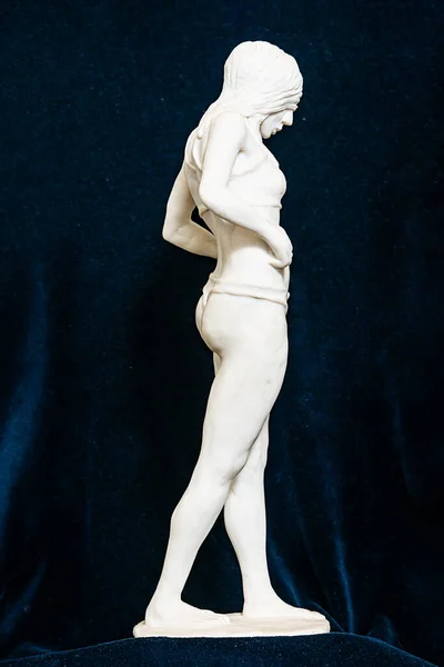 Gypsum sculpture of an unknown girl. The girl stands