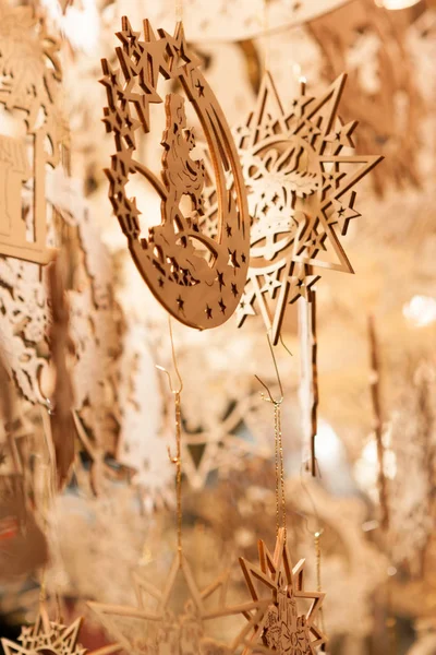 stock image Star shaped wooden christmas decorations hanging at a christmas market