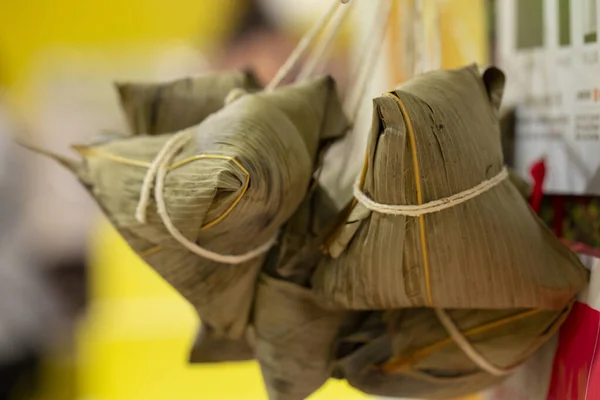 Dumplings hanging on the lunar calendar for the Dragon Boat Festival (text: beautiful, June)