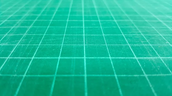 Close-up green cutting mat rubber-stamp background — Stock Photo, Image