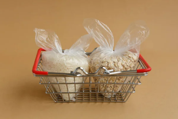 Various Groats Packages Grocery Basket Brown Background Rice Oatmeal — Stock Photo, Image