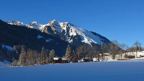 Winter scene in Gsteig bei Gstaad. Switzerland. — Stock Photo, Image