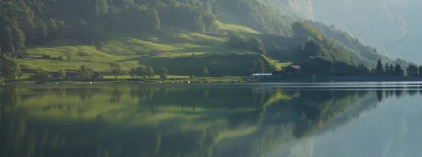Fogy morning at lake Klontalersee Switzerland. — Stock Photo, Image