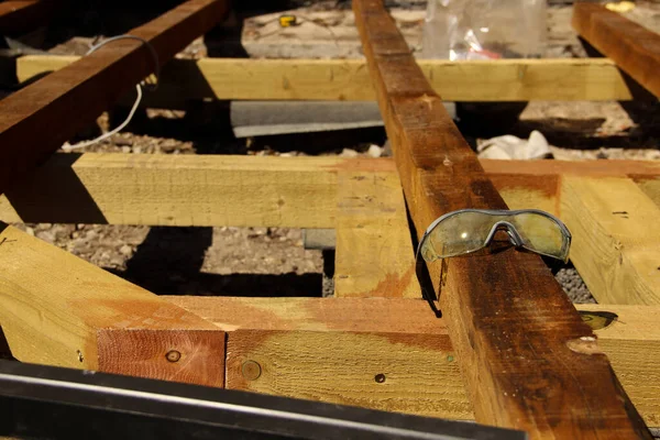 Plastic Safety Glasses Used Safety Goggles Lying Beam — Stock Photo, Image