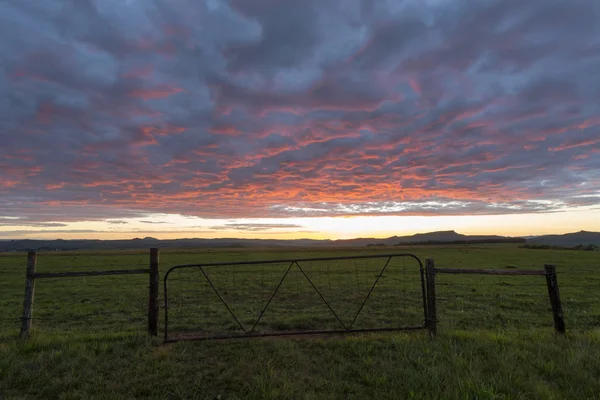 Early morning light and a gate — Stock Photo, Image