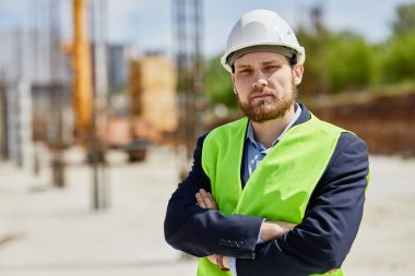 An engineer in uniform looks at the camera.