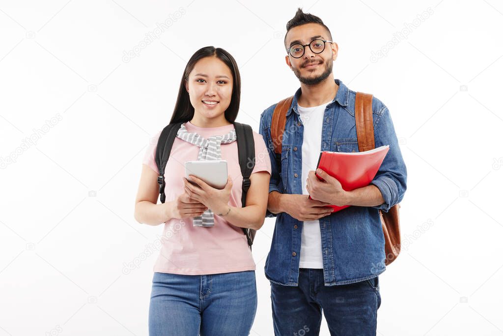 Girl and her boyfriend pose at the camera together at the university.