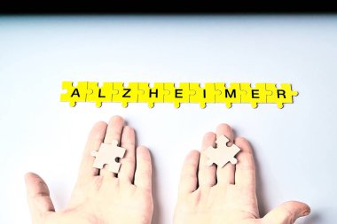 Alzheimer hastalığı, kavramı, Alzheimer kelimesi siyah harfli sarı bulmacalardan oluşur.