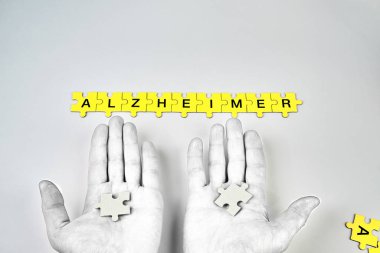 Alzheimer hastalığı, kavramı, Alzheimer kelimesi siyah harfli sarı bulmacalardan oluşur.
