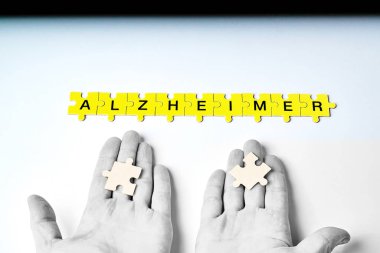 Alzheimer hastalığı, kavramı, Alzheimer kelimesi siyah harfli sarı bulmacalardan oluşur.