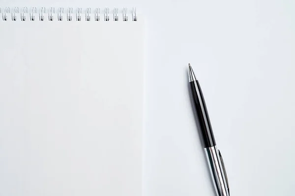 White office Desk top view with Notepad and pen,minimalistic design,top view,copy space,flat lay — Stock Photo, Image