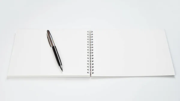 White office Desk top view with Notepad and pen,minimalistic design,top view,copy space,flat lay — 스톡 사진