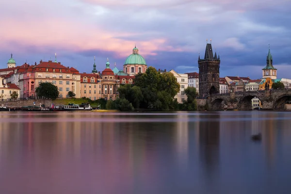 panorama of Old Town Bridge Tower at Charles Bridge in Prague at sunset