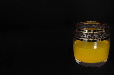 Glass of yellow sweet soda