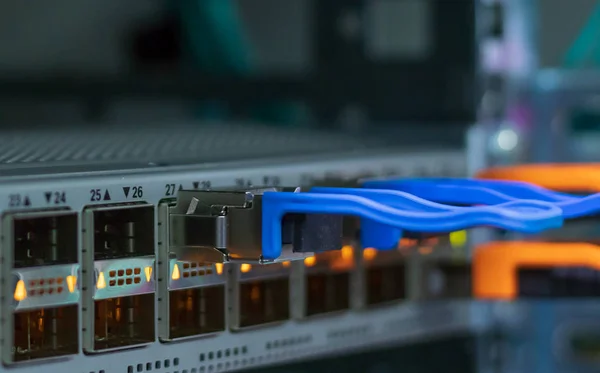 Network switch. Modern network switch speed 40 - 100 Gigabit Ethernet ports. Closeup of optical module at data center of the internet provider. Internet network communication.