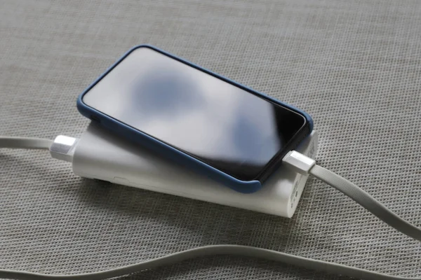 phone and usb portable charger on the table together